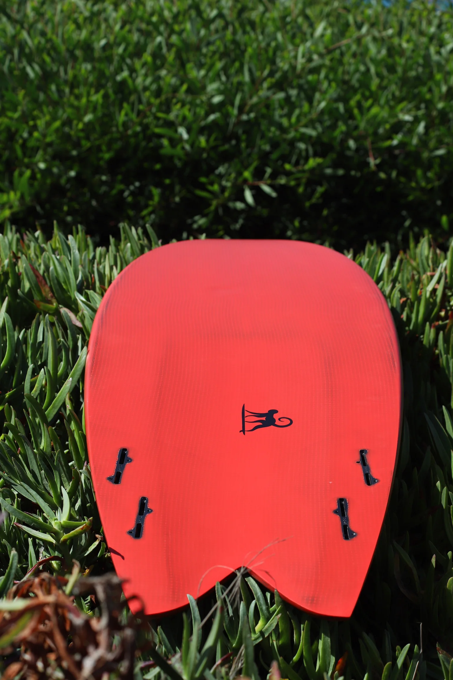 Quad fish bottom in red tinted resin, carbon-Kevlar weave under the tint